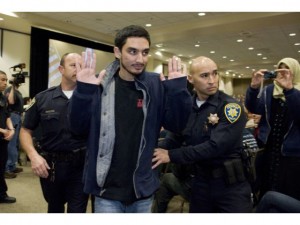 Officers arresting the IslamoFascists