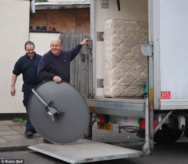 Furniture movers (paid for by taxpayers) unload Qatad'a satellite dish