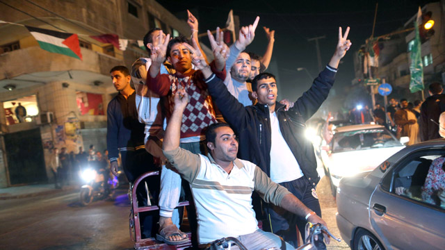 Palestinians celebrate the ceasefire between Israel and militant factions led by Hamas