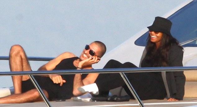 On the boat, Wissam looks cool but Janet must be sweating in her black garbage bag