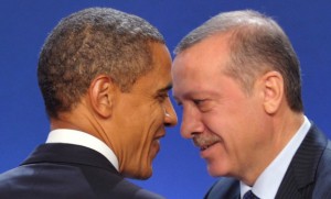 U.S. President Obama and Turkey's Prime Minister Erdogan take part in a family photo during the G20 Summit in Cannes