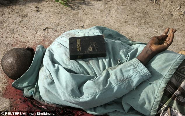 Islamist al-Shabab gunmen apparently placed a Bible on the back of this man after they killed him during the attack on Hindi village, in Lamu county on the coast of Kenya, in which nine people were killed 