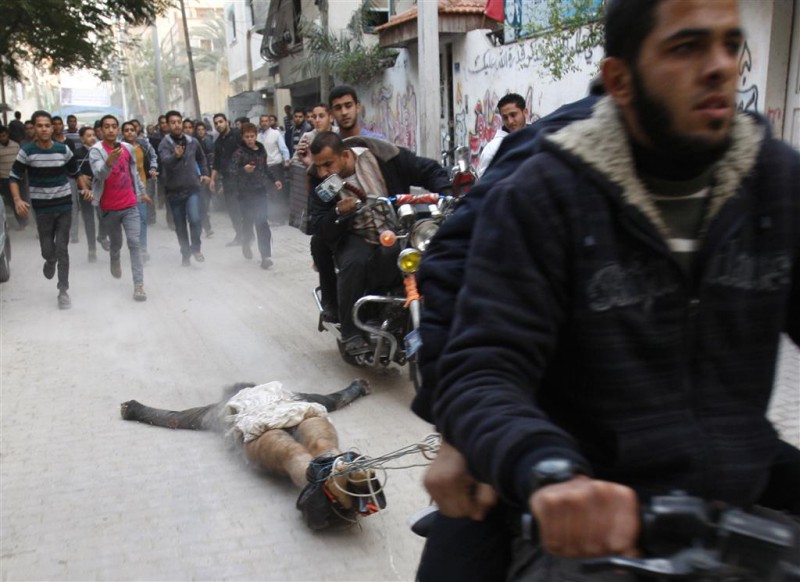 Dragging the bodies of alleged informers through the streets of Gaza
