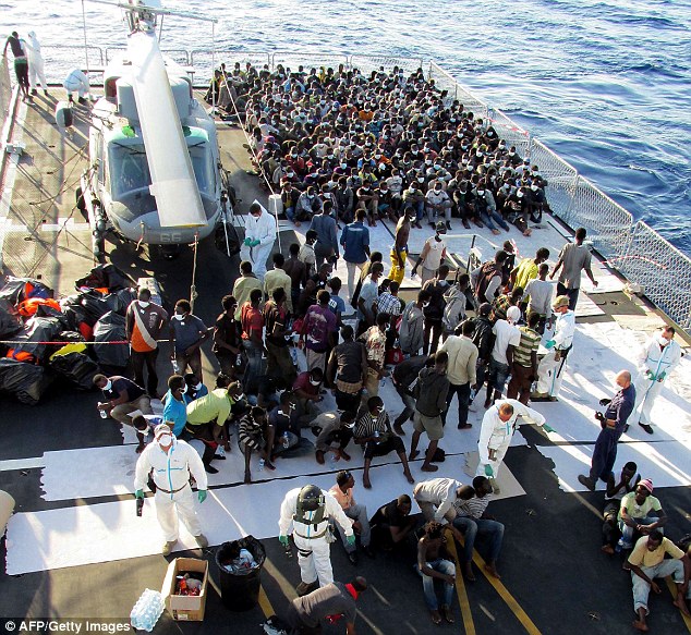 1414488155873_wps_23_Rescued_migrants_aboard_t