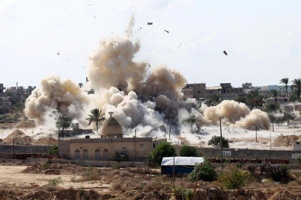 An image of Egyptian military demolishing homes in Northern Sinai on Wednesday to create buffer zone along the borders with Gaza 