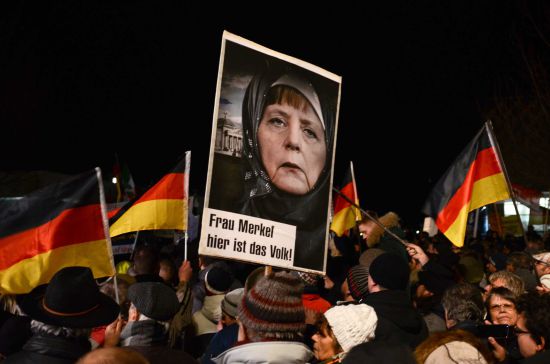 Chancellor Angela Merkel under fire for her mass Muslim immigration policies