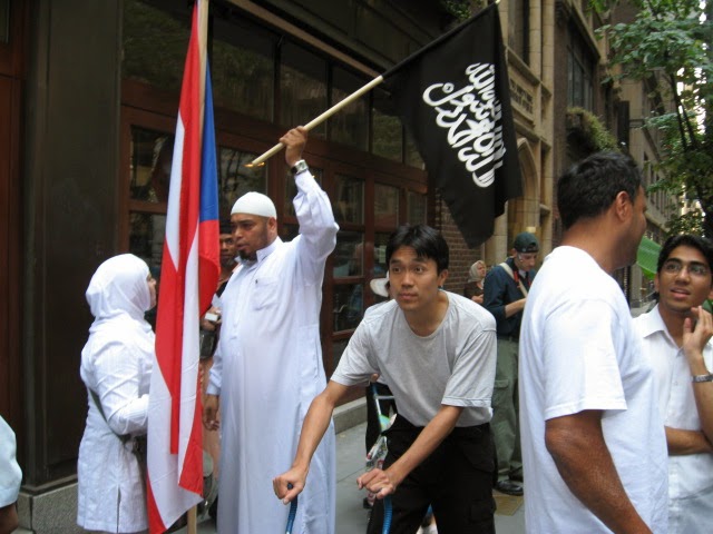 Abu Bakr with black flag of jihad