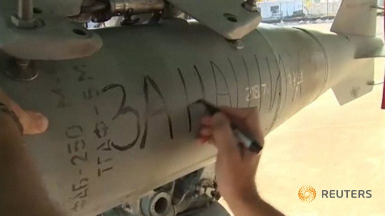 Russian Defence Ministry also shows a message being written by an air force technician saying 'For Ours' 