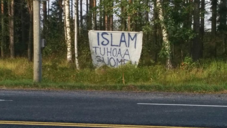 Banner says "Islam is destroying Finland"