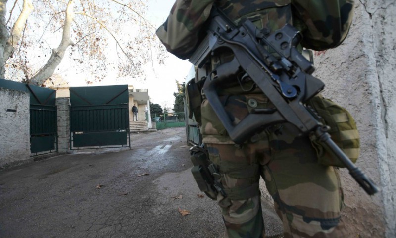 An armed French soldier secures the access to a Jewish school in Marseille 9th district