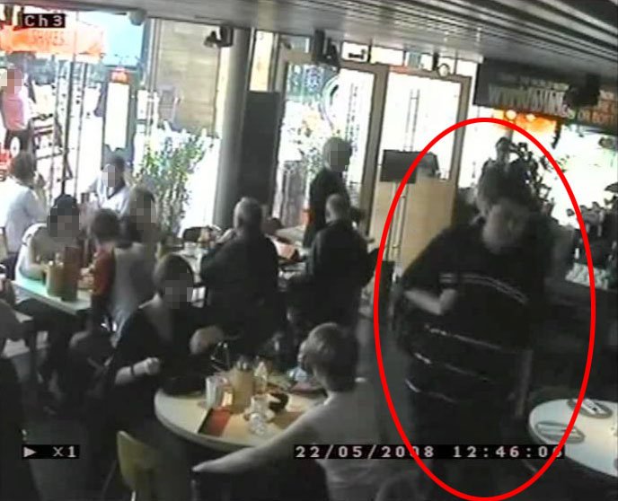 Reilly seen on camera carrying the explosives inside the restaurant