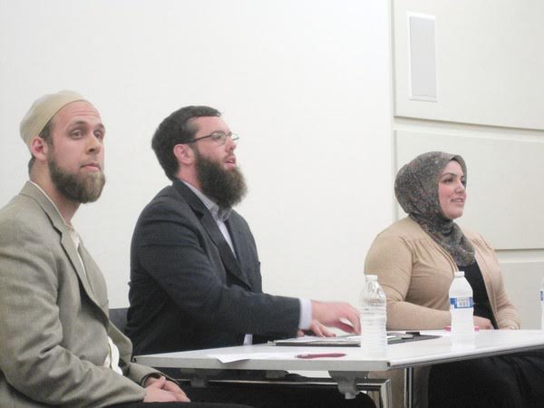 From left, Amir Toft, Thomas Maguire and Iman Sedique speak about their Islamic faith at the Orland Park Public Library Thursday. The forum often turned tense as some audience members expressed their distrust of Muslims.